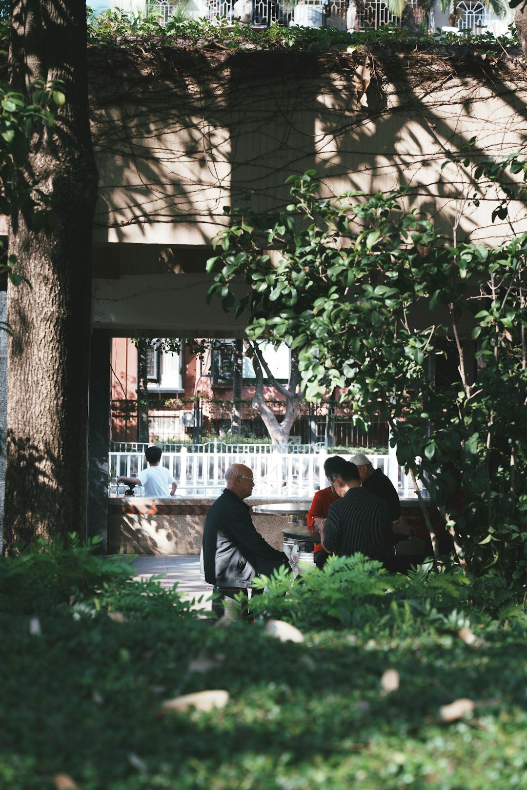Group of Danish neighbours gathered at an outdoor community table
