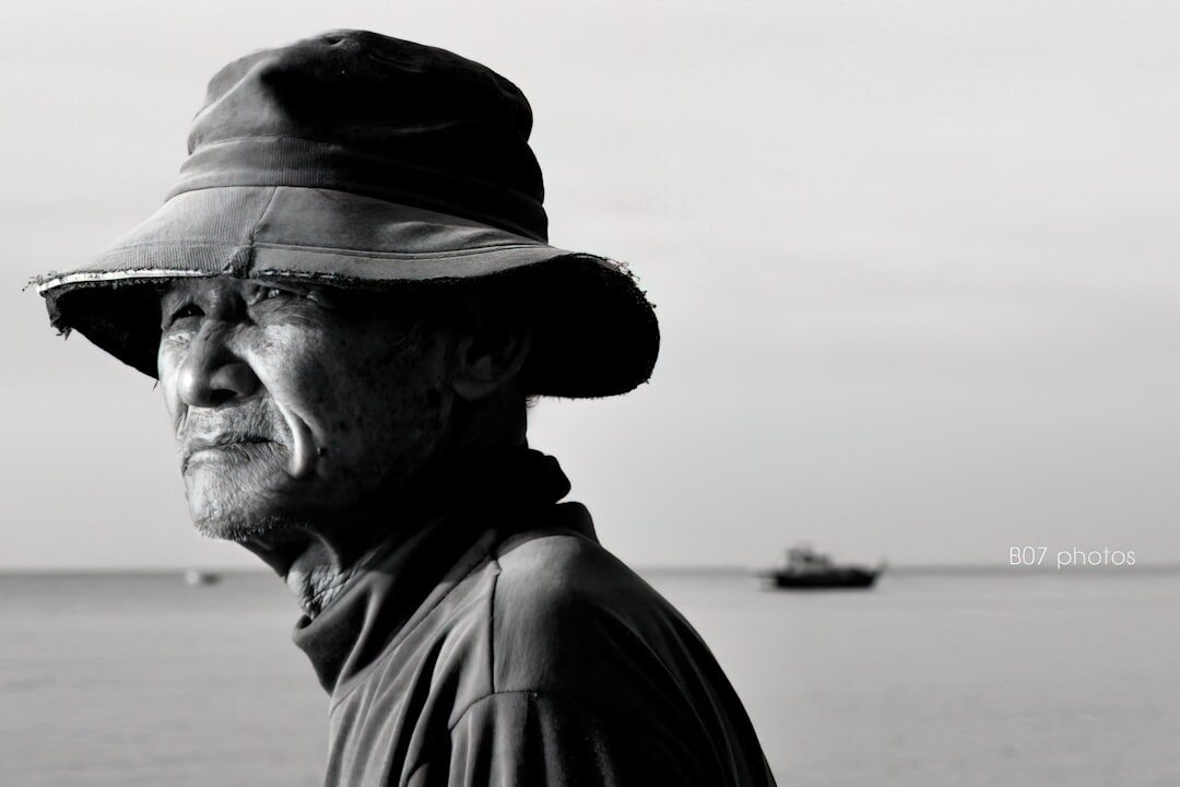 Elderly Danish fisherman portrait on a harbor pier